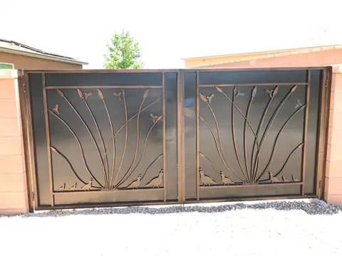 Double drive gate with cut steel desert reeds and quail in a bronze finish